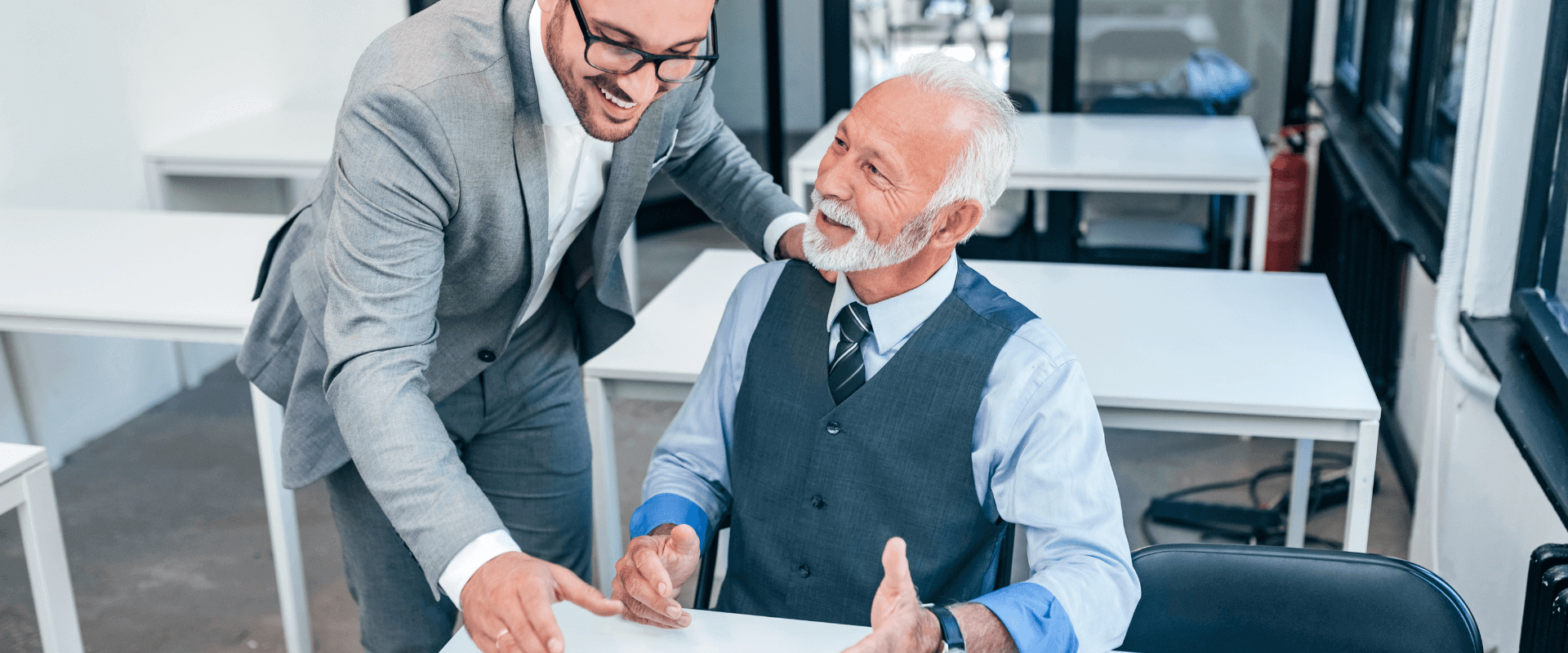 IT Support Specialist Helping Client at Computer